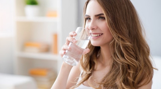 happy woman drinking water