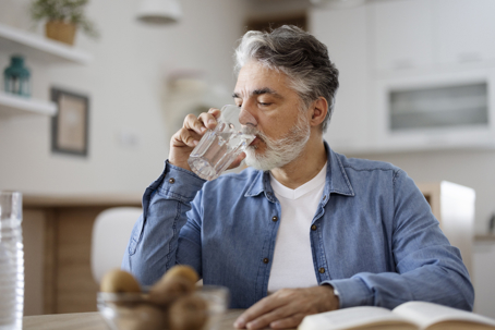 man drinking water