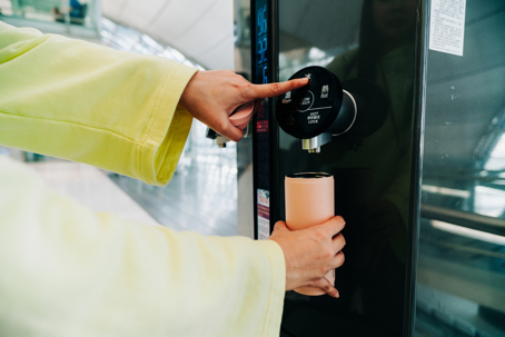 woman getting water from a dispenser